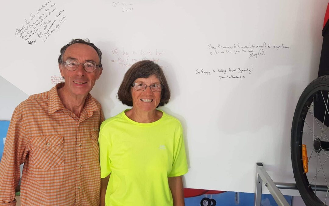 Daniel & Frédérique in front of our wall of fame