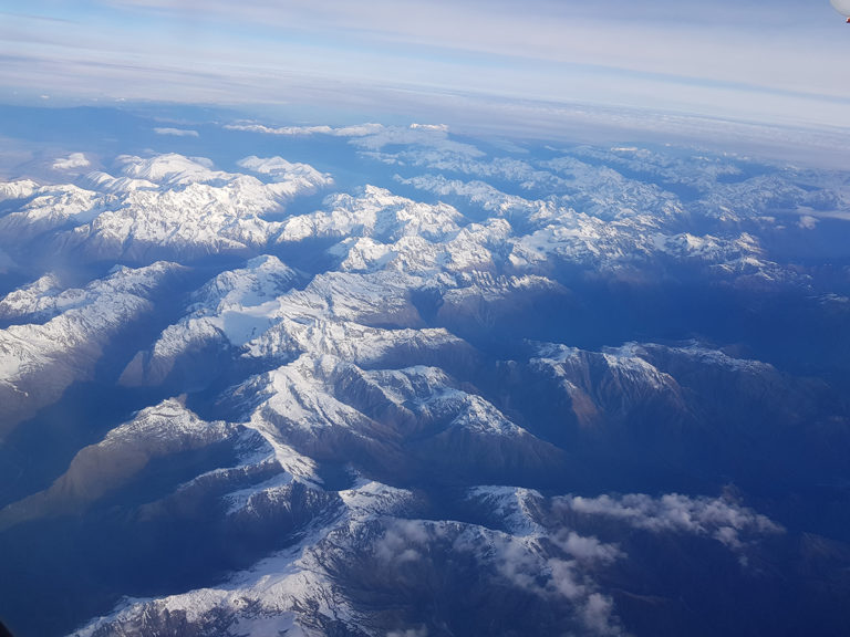 Leaving behind the snowy peaks of The Southern Alps of New Zealand