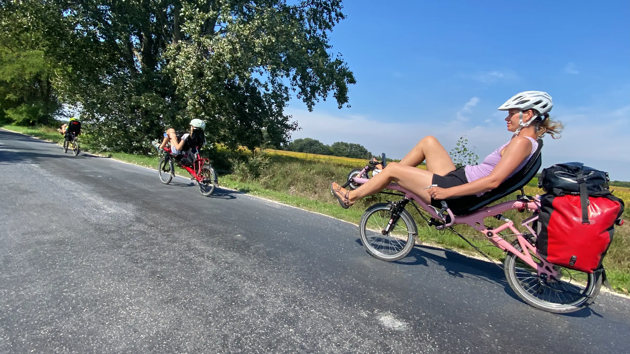 Family of four touring on recumbent bicycles through nearby countries