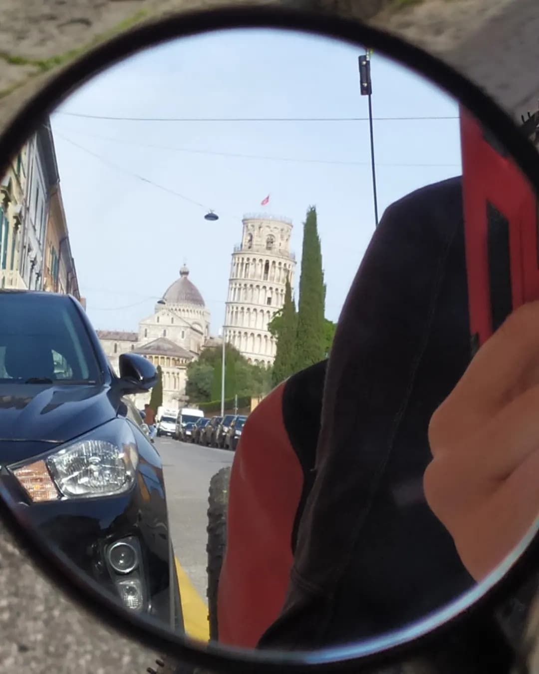 Leaning tower of Pisa in the bike mirror